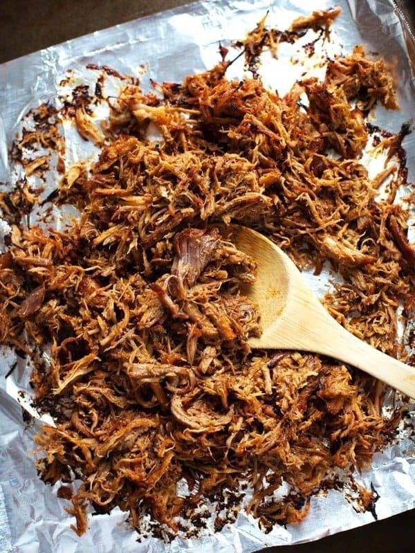 Super Easy Crockpot Shredded Pork - and a trick for getting those deliciously golden crispy bits! | pinchofyum.com