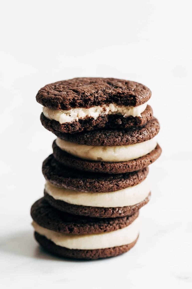 Homemade oreos stacked together.