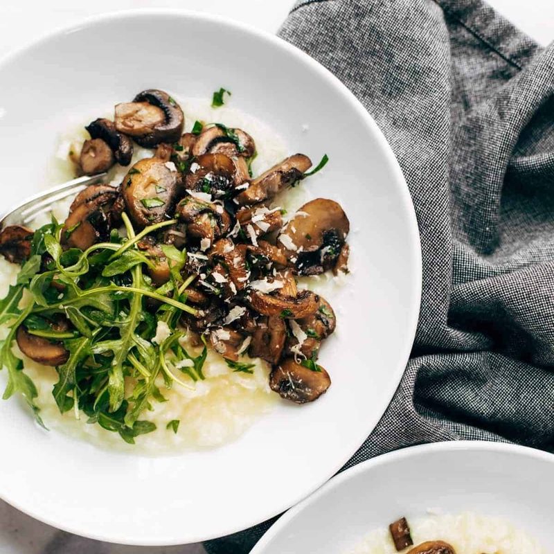 A picture of Oven Risotto with Garlic Roasted Mushrooms and Arugula