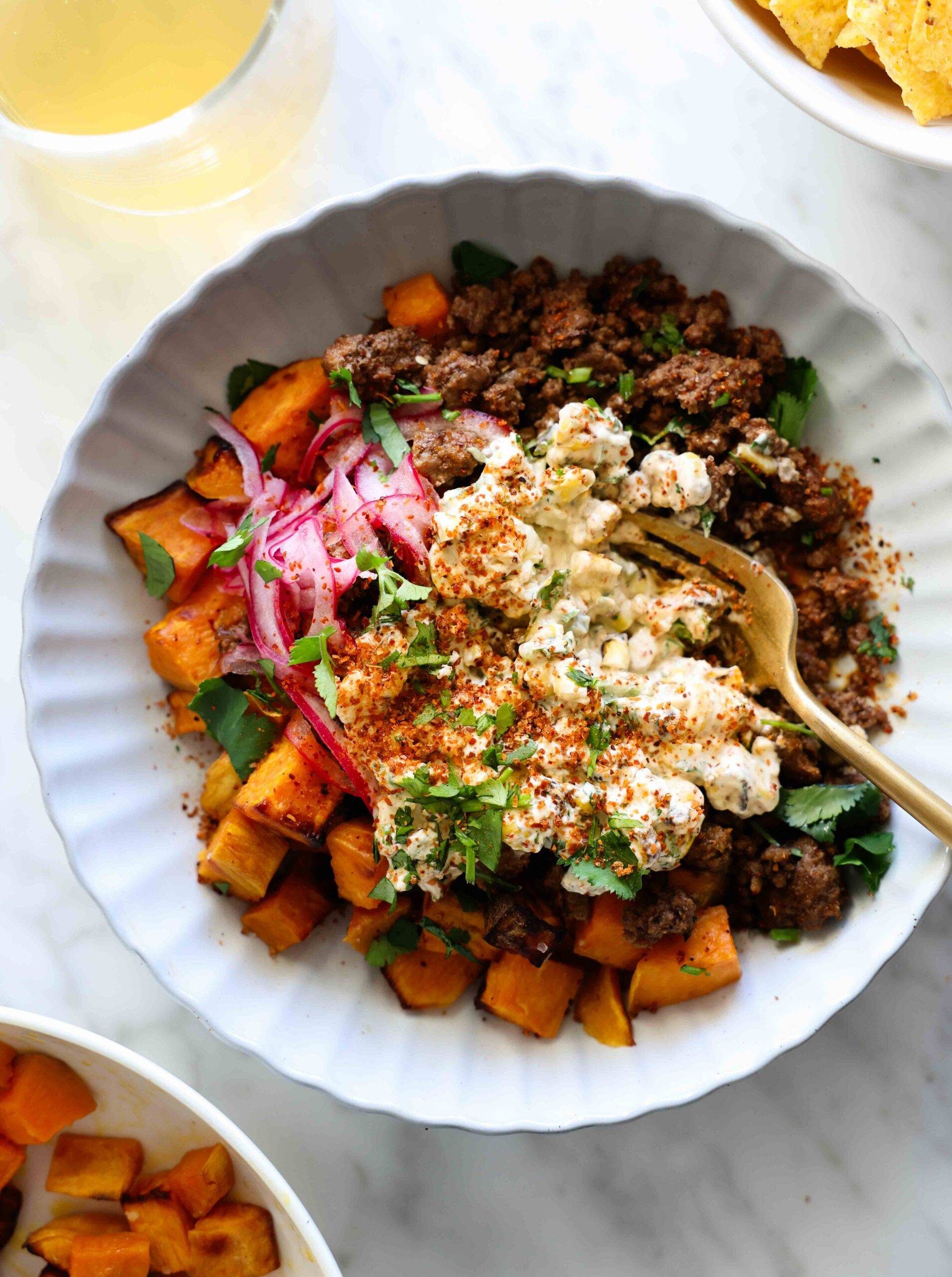 Sweet potato, beef, and street corn in a bowl.