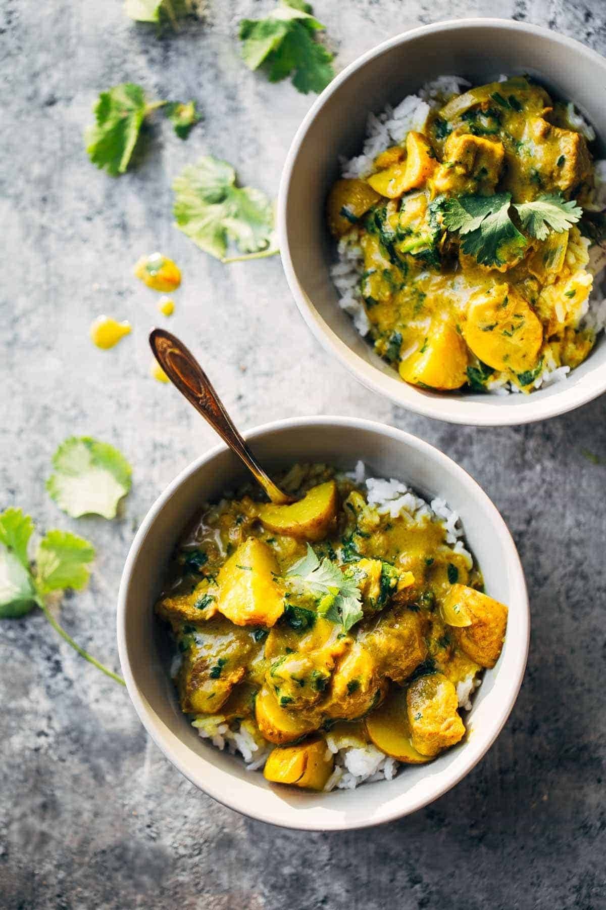 Thai Yellow Curry with Beef and Potatoes in two bowls.