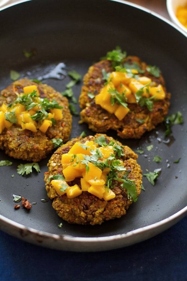 Curried veggie burgers in a skillet.