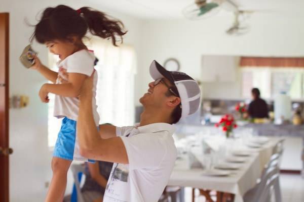 Man holding a child.