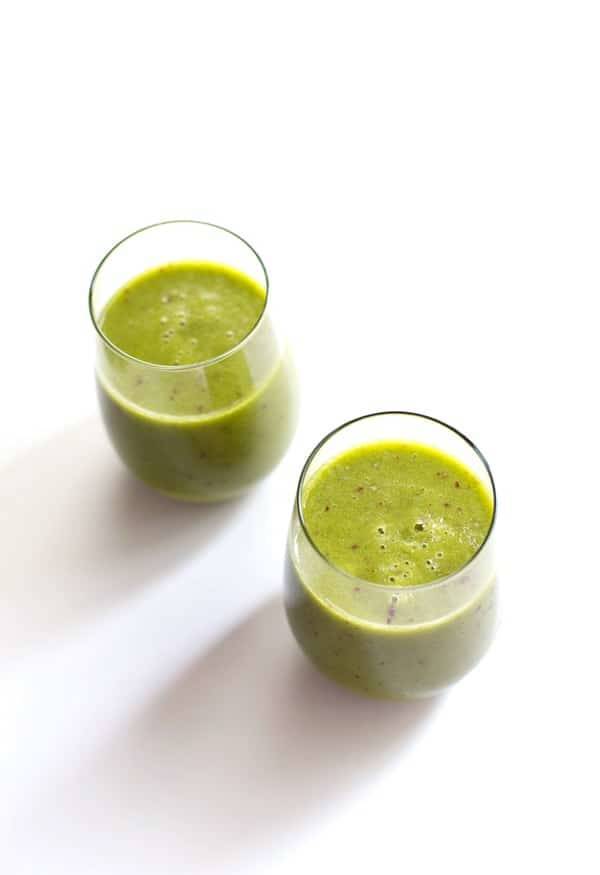 Peach green smoothies in glasses.