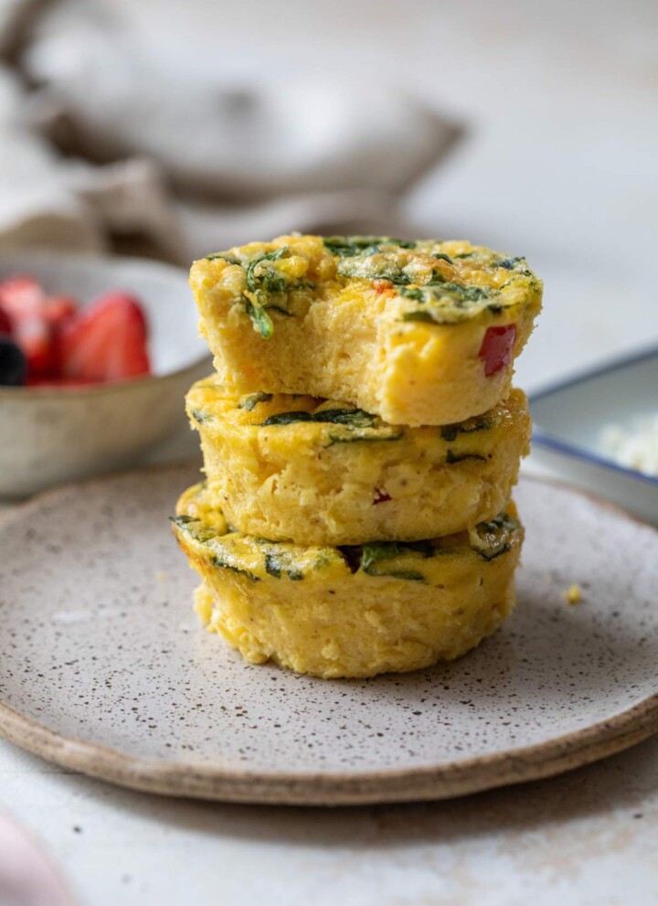 Three egg bites stacked on a plate.
