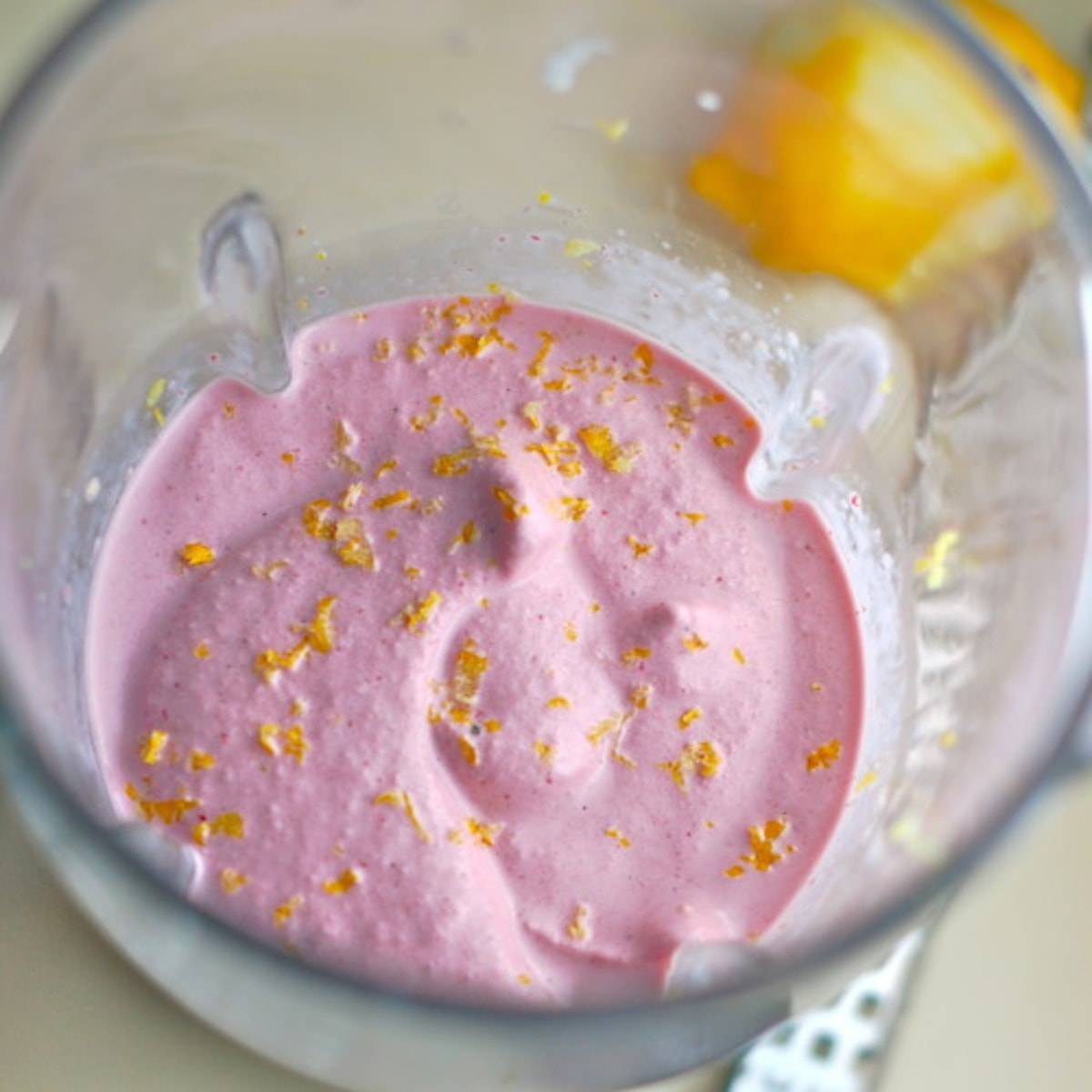 Lemon berry smoothie in a blender.