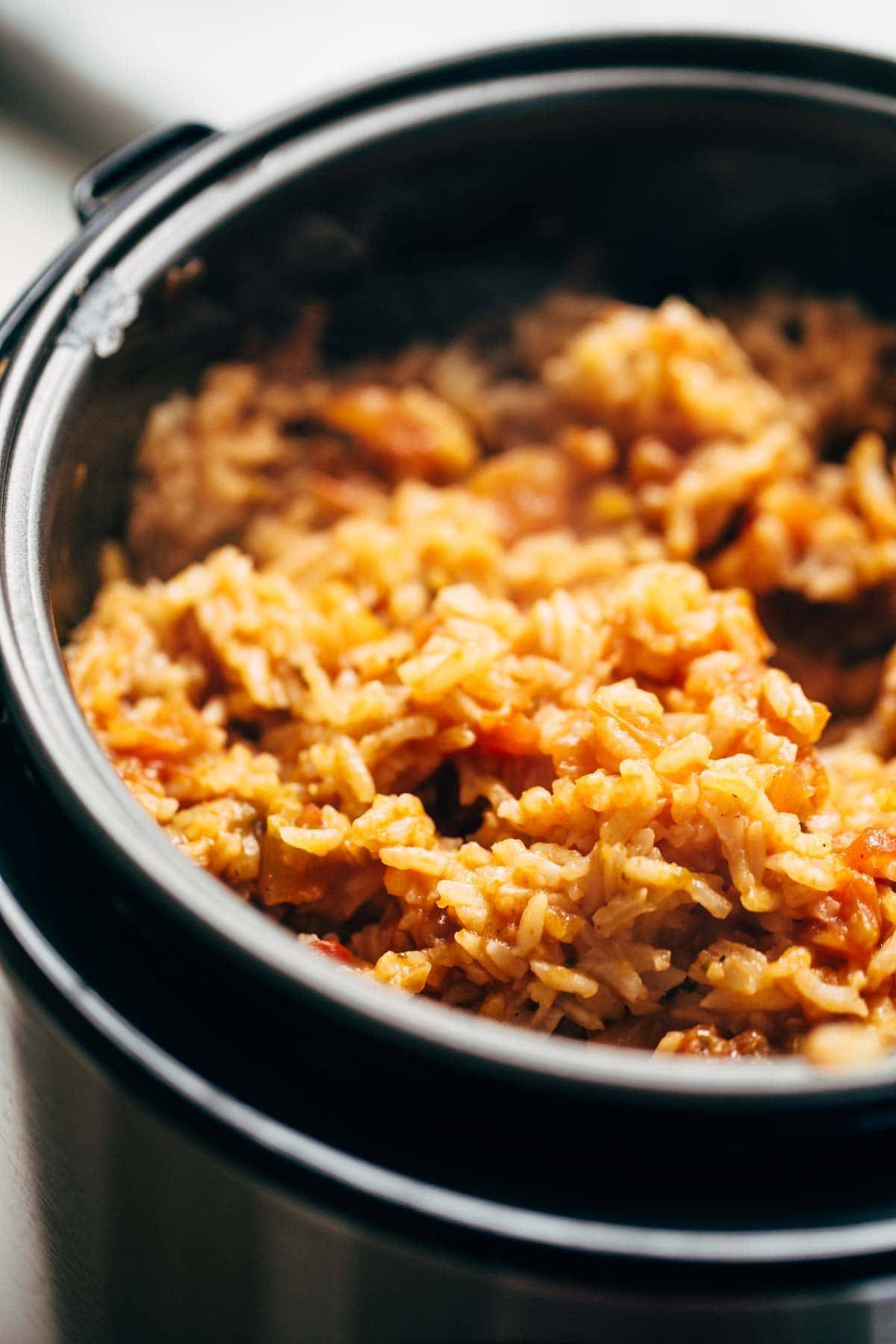Spicy Brazilian Burrito Bowls recipe featuring seasoned rice and beans, garlic cilantro lime slaw, and crispy fried plantains. So good // almost vegan. | pinchofyum.com