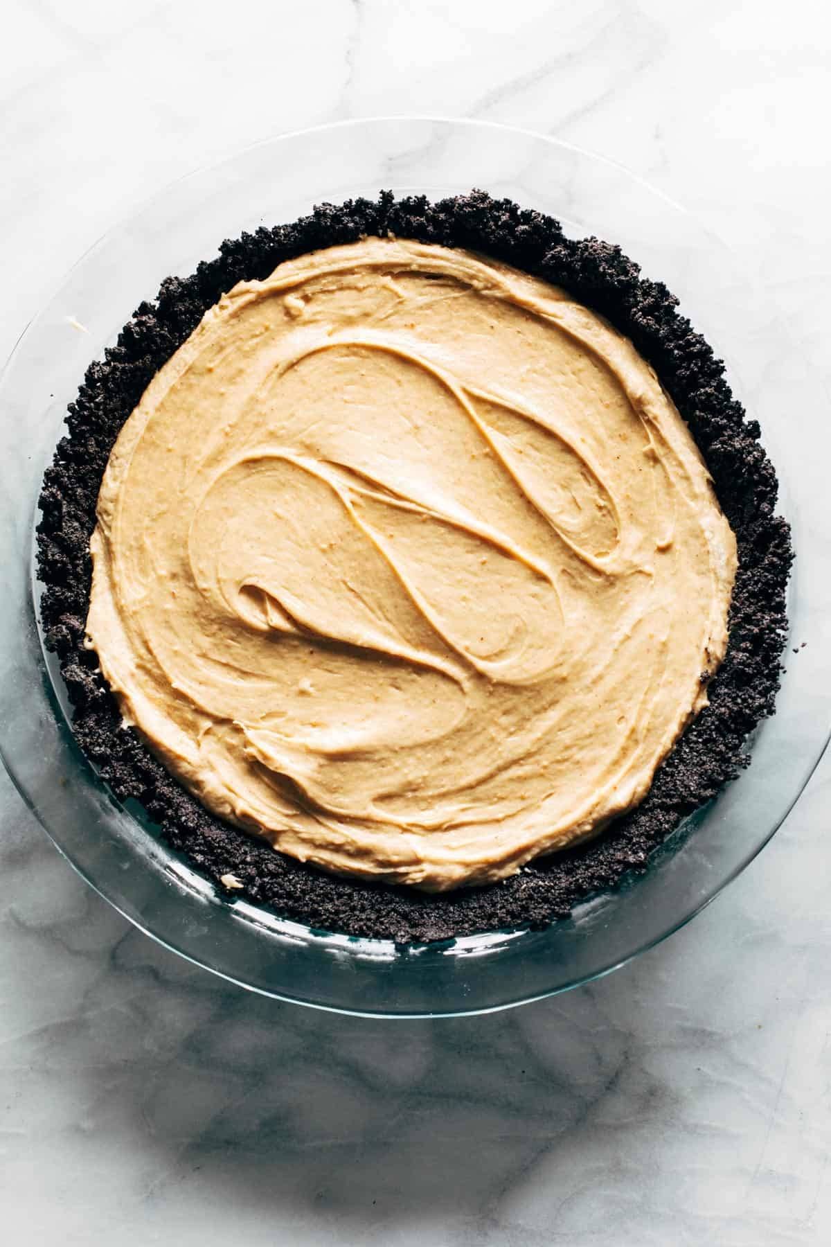 Peanut butter pie filling spread in crust.