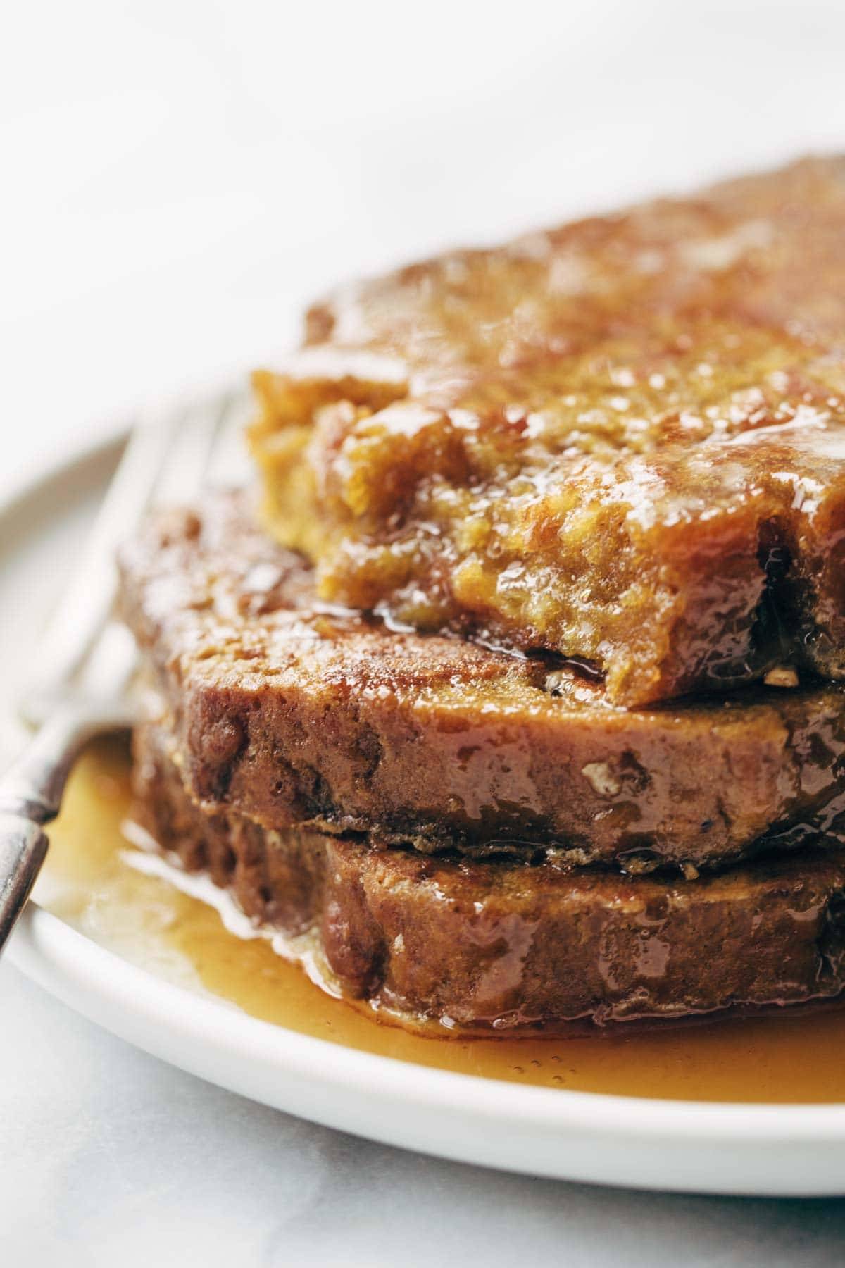 Pumpkin Bread French Toast - easy recipe with eggs, milk, vanilla, and a few pieces of pumpkin bread. Golden brown, sticky sweet brunch perfection. | pinchofyum.com