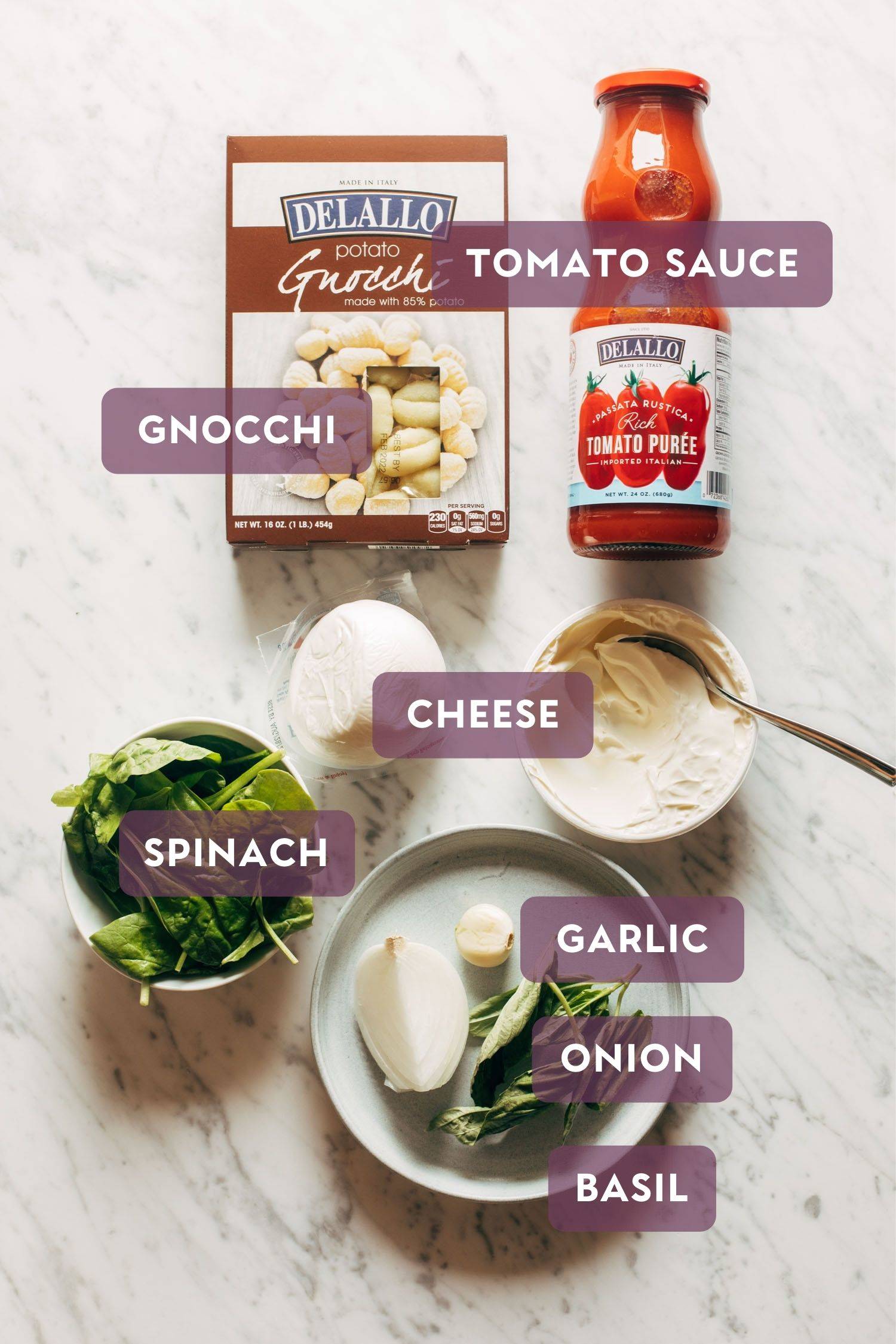 Ingredients for three cheese baked gnocchi. There's purple text over the top that says the name of each ingredient.