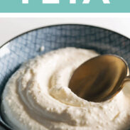 Whipped feta in a bowl with a spoon.