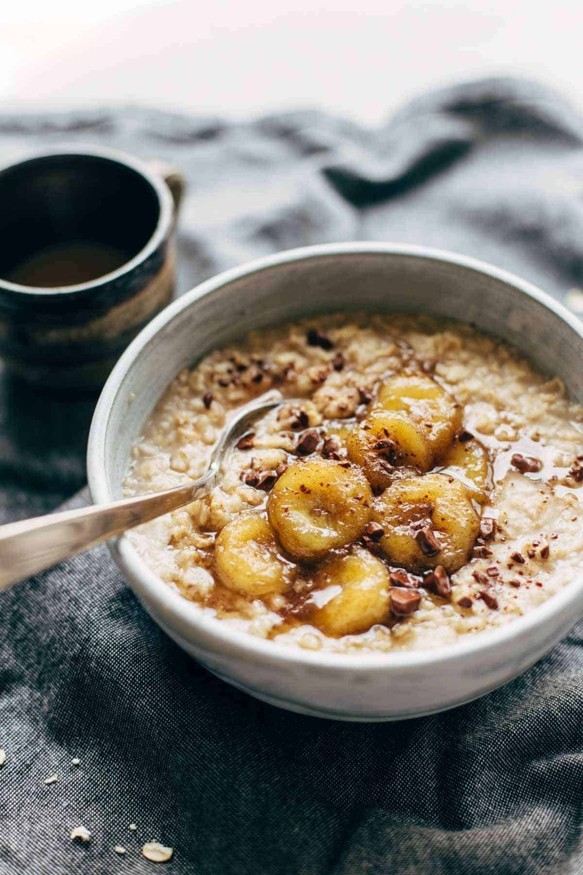 Caramelized Banana Oatmeal! Creamy oatmeal with bananas in a maple syrup/coconut oil glaze. No refined sugar! | pinchofyum.com