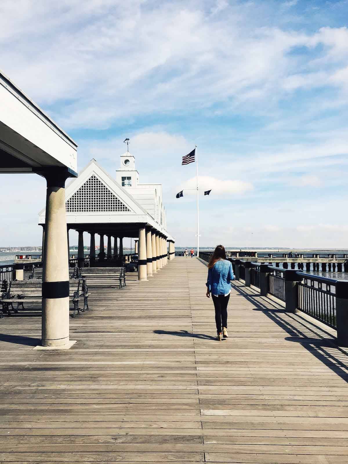 Woman walking down the boardwalk.